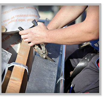 Worker Repairing Roof